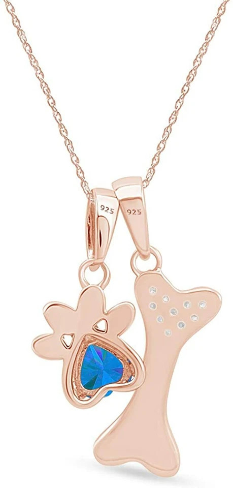 Colgante de topacio azul simulado con estampado de pata y hueso de perro en plata chapada en oro de 14 k Foto 3 de 4