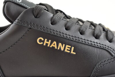 Chanel 23A Black Calfskin Leather Gold CC Logo Flat Runner Trainer