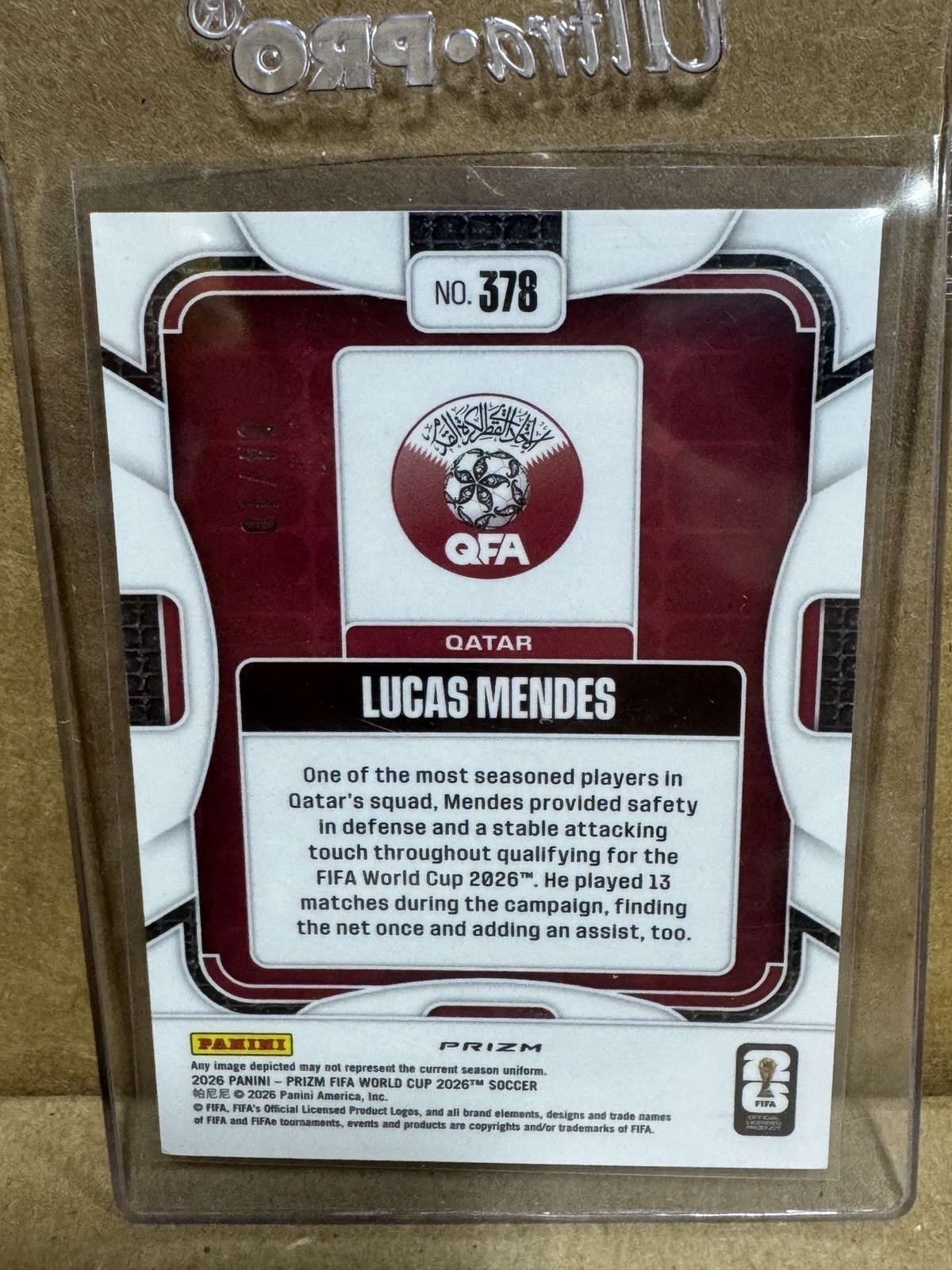 2026 Panini Prizm FIFA World Cup Lucas Mendes Qatar Gold Shimmer 4/10 RC view 2
