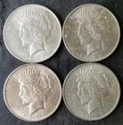 One 1922 and Three 1923 $1 Peace Silver Dollars
