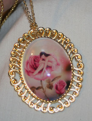 Swirl Rim Goldtne Lovely Little Pixie Sitting on a Rose Necklace Pendant Brooch