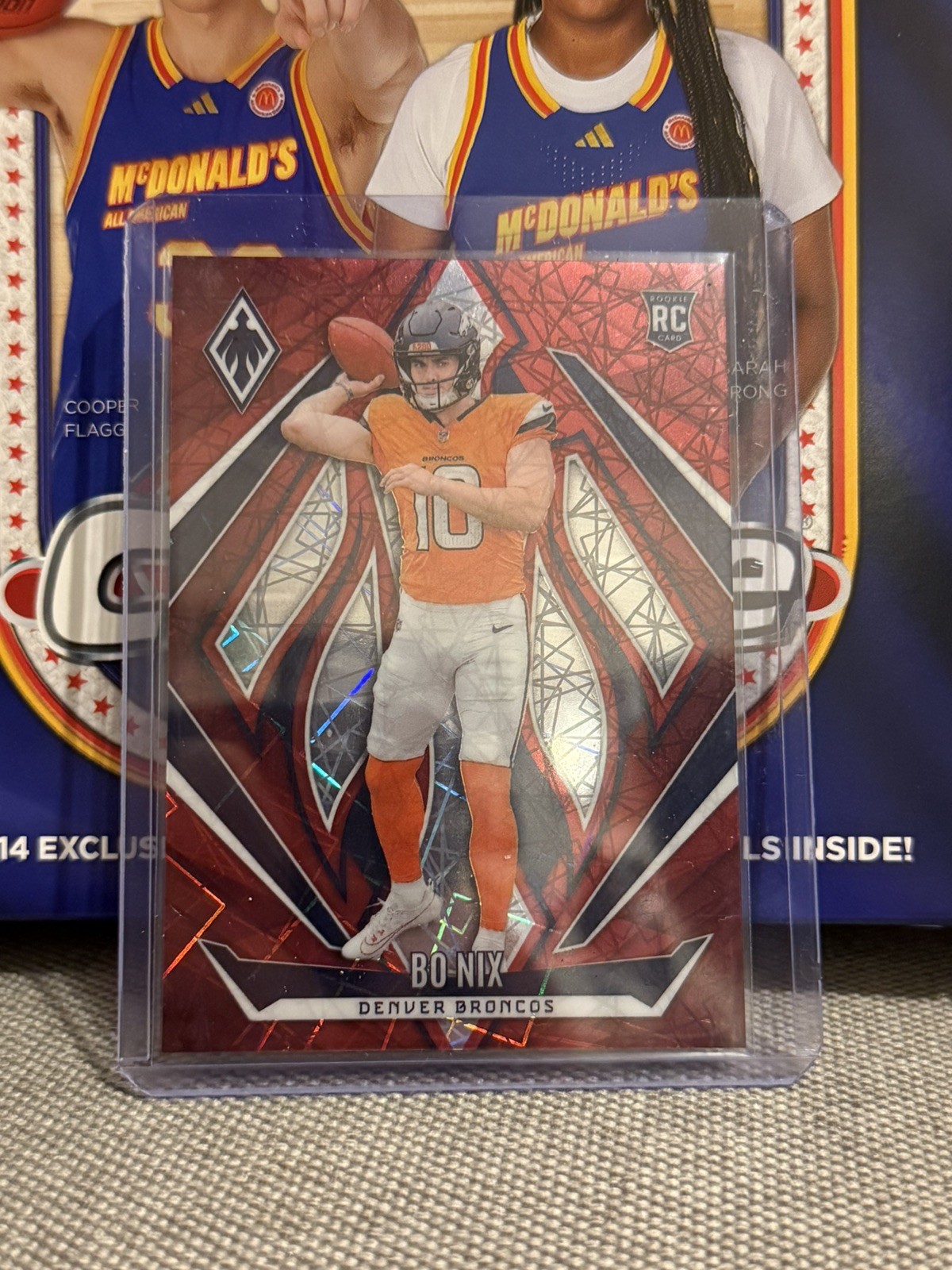 2024 Panini Phoenix - Rookies Bo Nix #159 Red Lazer /199 (RC)