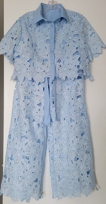 Elegant light blue women's lace set, consisting of lined trousers and a top.S