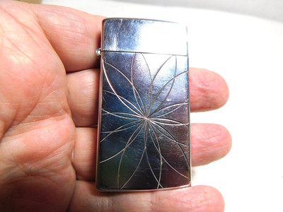 Vintage Used Scripto Butane Cigarette Lighter with Floral Inscribed Lines Design