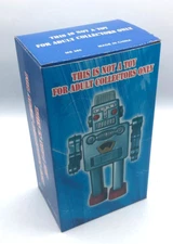 Blue Robot Spaceman Windup Tin Toy Robot NIB Circa 2000 Non-Smoking edition.