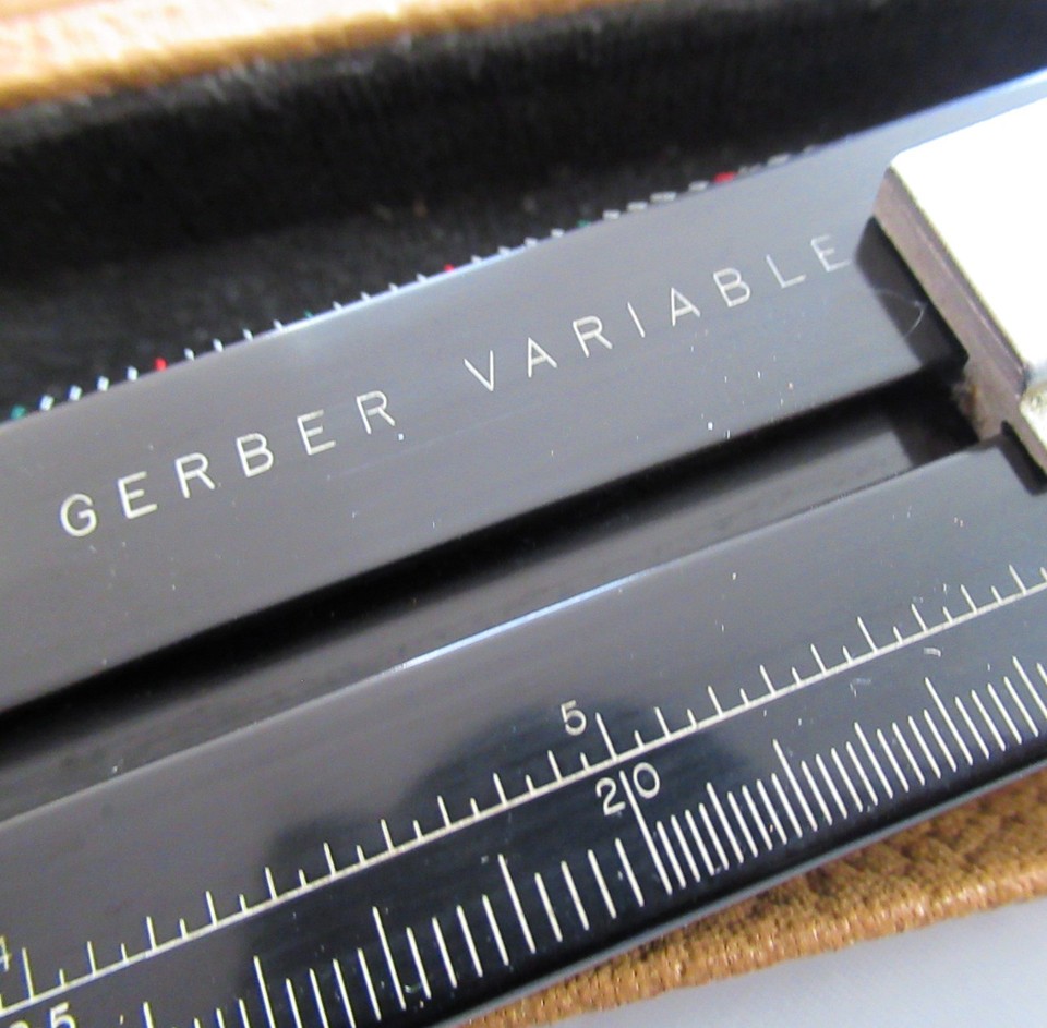 A genuine drafting-era variable scale instrument — the kind of analog precision tool that looks like a prop from a Jules Verne novel.