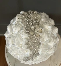 Bride Holding Flowers, Elegant Wedding bouquet pearls and brooches