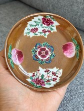 A Chinese Famille Rose Floral and Peach Saucer, Qianlong Period