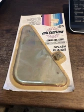 1 SET OF NEW GENUINE CAL CUSTOM STAINLESS SPLASH GUARDS #4026 VINTAGE OLD