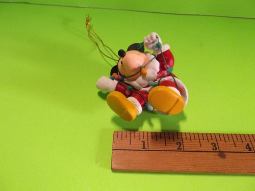 Disney's Mickey Mouse Dressed Up as Santa Tangled in Christmas Lights - Picture 6 of 9