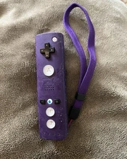Nintendo Wii remote. Purple, sticky silicone cover
