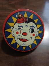 Vintage US Metal Toy - Clown Noise Maker - 4" - twist wooden handle makes noise