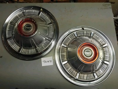 Two 1966 Ford Country Squire 15'' hubcaps