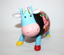 A Ceramic Hand Painted Cow Money Bank