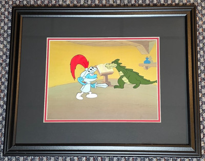 SMURFS PRODUCTION ANIMATION CEL OF HEFTY SMURF FRAMED ON BACKGROUND