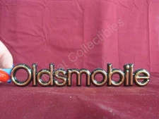 NOS OEM Oldsmobile Regency Gold Trunk Emblem Name Plate 1991 - 93