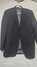 Classic black wool blazer/sport coat. Features single-breasted two-button...