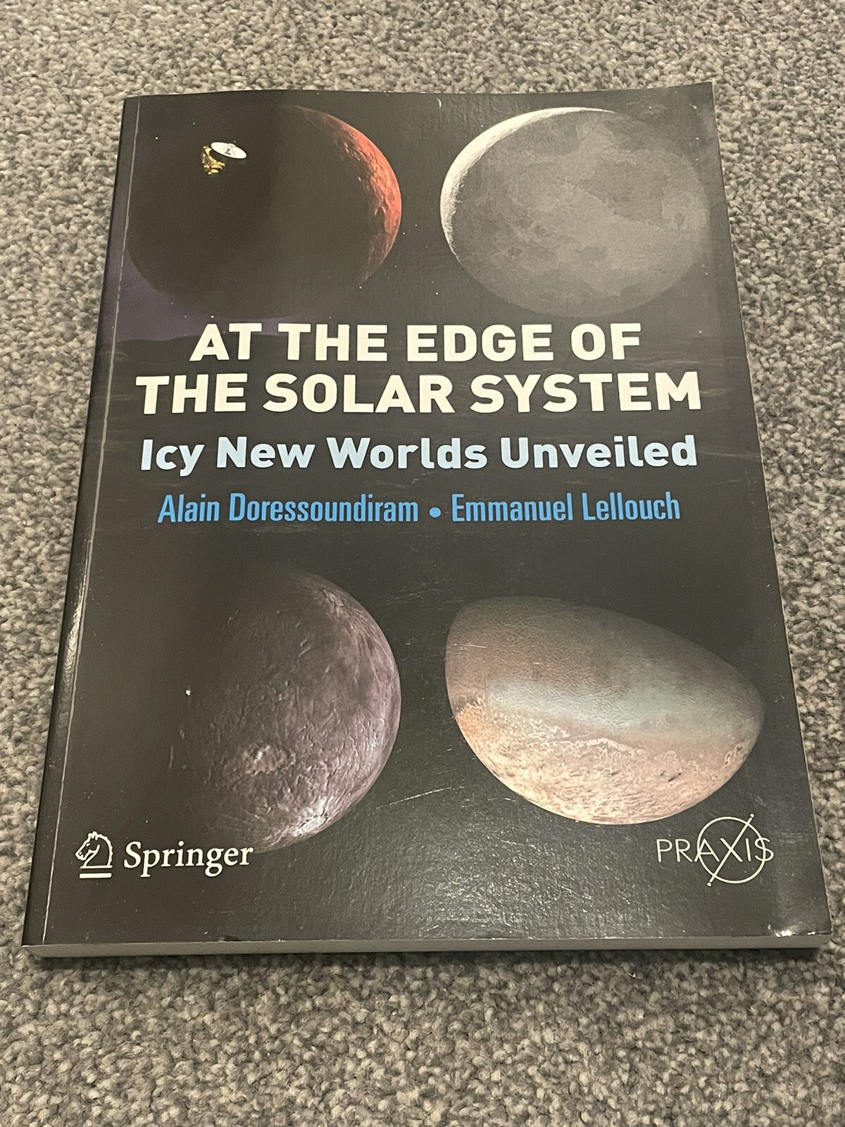 At the Edge of the Solar System : Icy New Worlds Unveiled Paperba