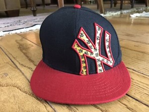 black and yellow yankees hat