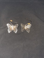 3 D, silver-tone butterfly dangle earrings with round crystal in center of body