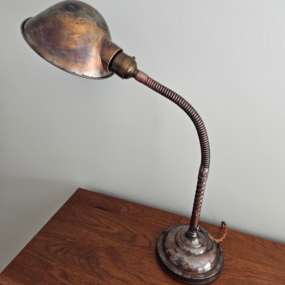 A genuine antique Faries brass gooseneck lamp — a factory-era American classic that looks incredible on any desk and actually works as lighting.