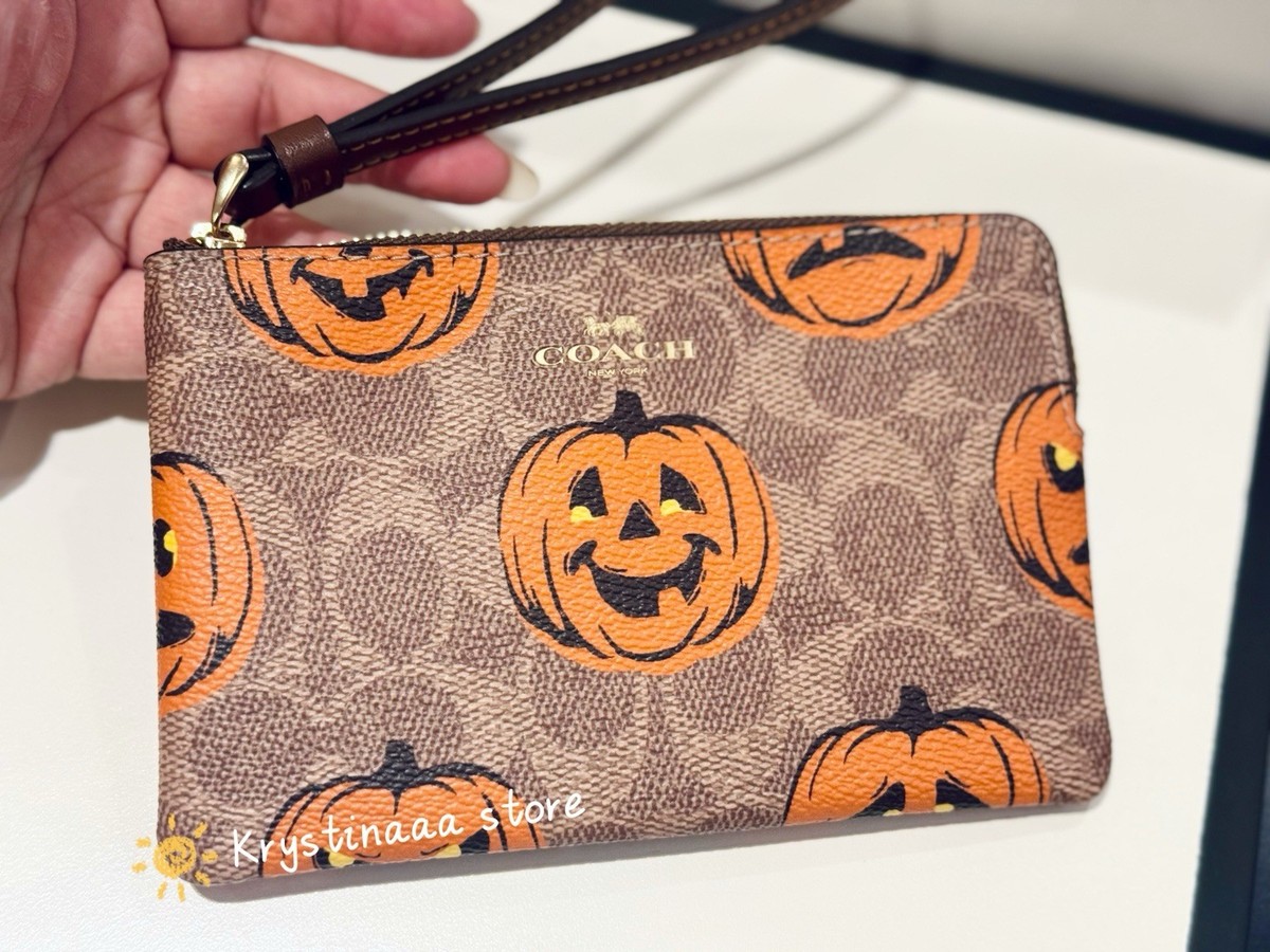 Coach Corner Zip Wristlet in Signature Canvas With Pumpkin Print
