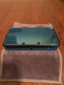 Nintendo 3DS Aqua Blue System w/ Pokemon Alpha Sapphire TESTED 64GB SD + Charger