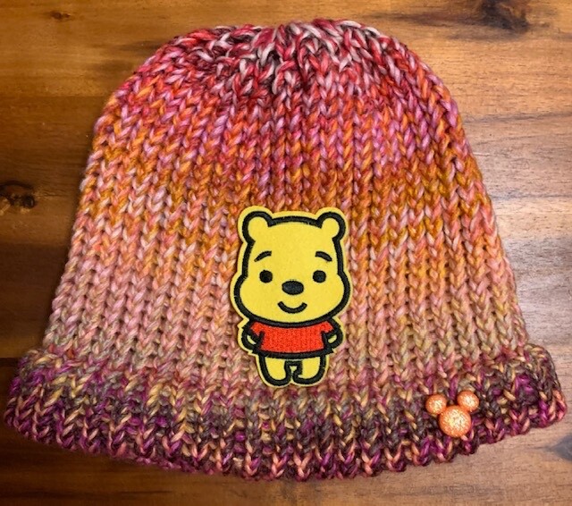 Disney Winnie the Pooh on multi colored beanie