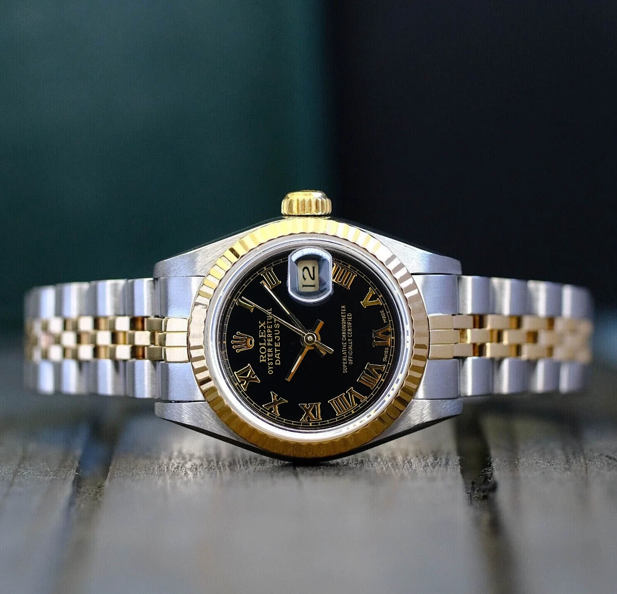 ROLEX LADIES DATEJUST GOLD STEEL BLACK ROMAN DIAL 18KY FLUTED 26MM WATCH 69173