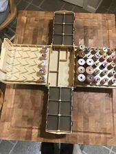 fold out sewing box with 30 wood spools of thread