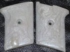 Phoenix Arms Raven 25 ACP pistol grips pearl white smooth slide safety plastic