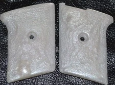 Phoenix Arms Raven 25 ACP pistol grips pearl white smooth slide safety plastic