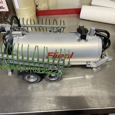 Bruder Toys Fliegl Barrel Trailer with Spread Tubes