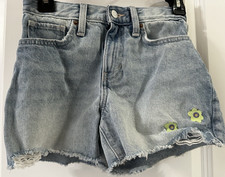 Girls Old Navy distressed denim shorts with raw hem and 2 flowers size 12