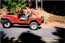 Man And Boy Driving Red Jeep In The Forest Found Photo V2196
