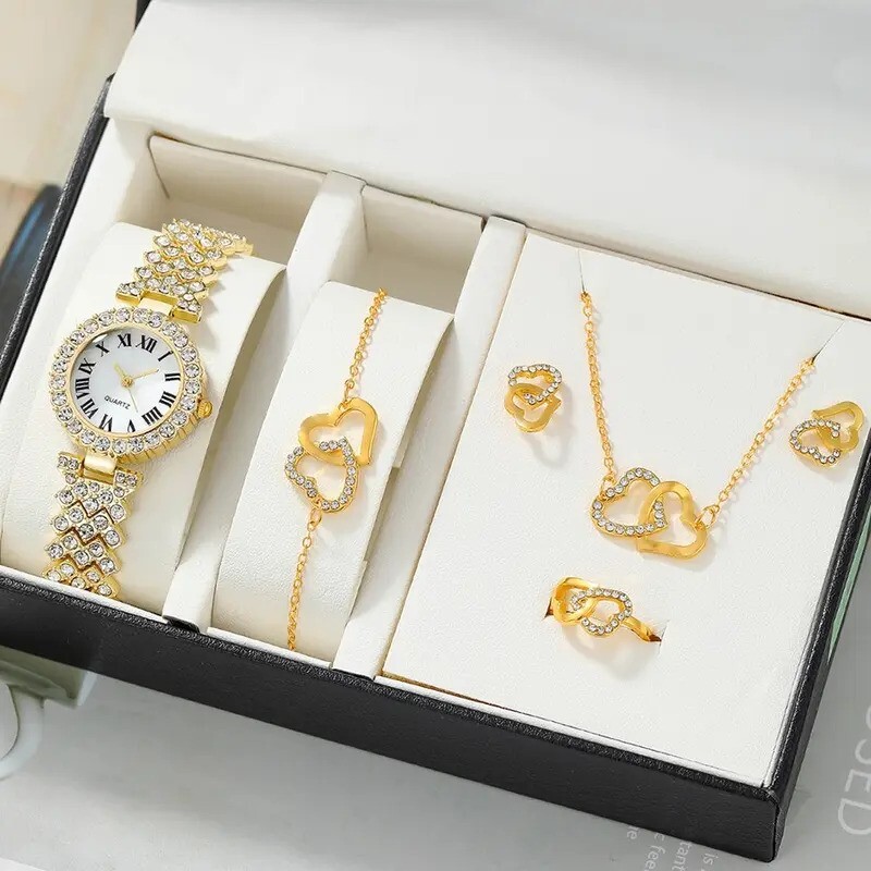 Montre luxe femme avec ensemble bijoux coeur en or rose pour tenue de soirée chic