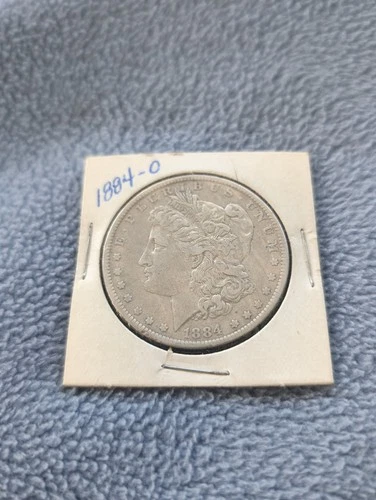 1884 O Morgan Silver Dollar.