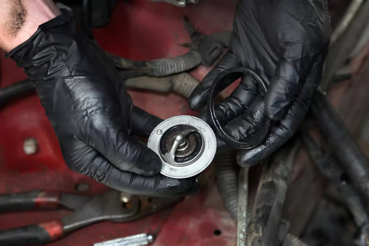 Examining the water pump’s original silicone seal.