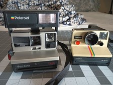 Lot of 2 Polaroid Cameras: Sun 600 LMS and One Step BC Series  straps Untested
