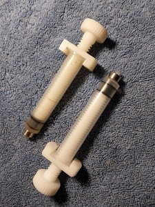 Two 10cc Pressure Regulating Syringes. Used Good