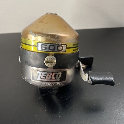 Vintage Zebco 600 Spin casting Reel Gold and Black Model. MADE IN