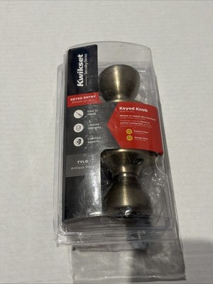 Kwikset Tylo Antique Brass Exterior Keyed Entry Door Knob Featuring Microban
