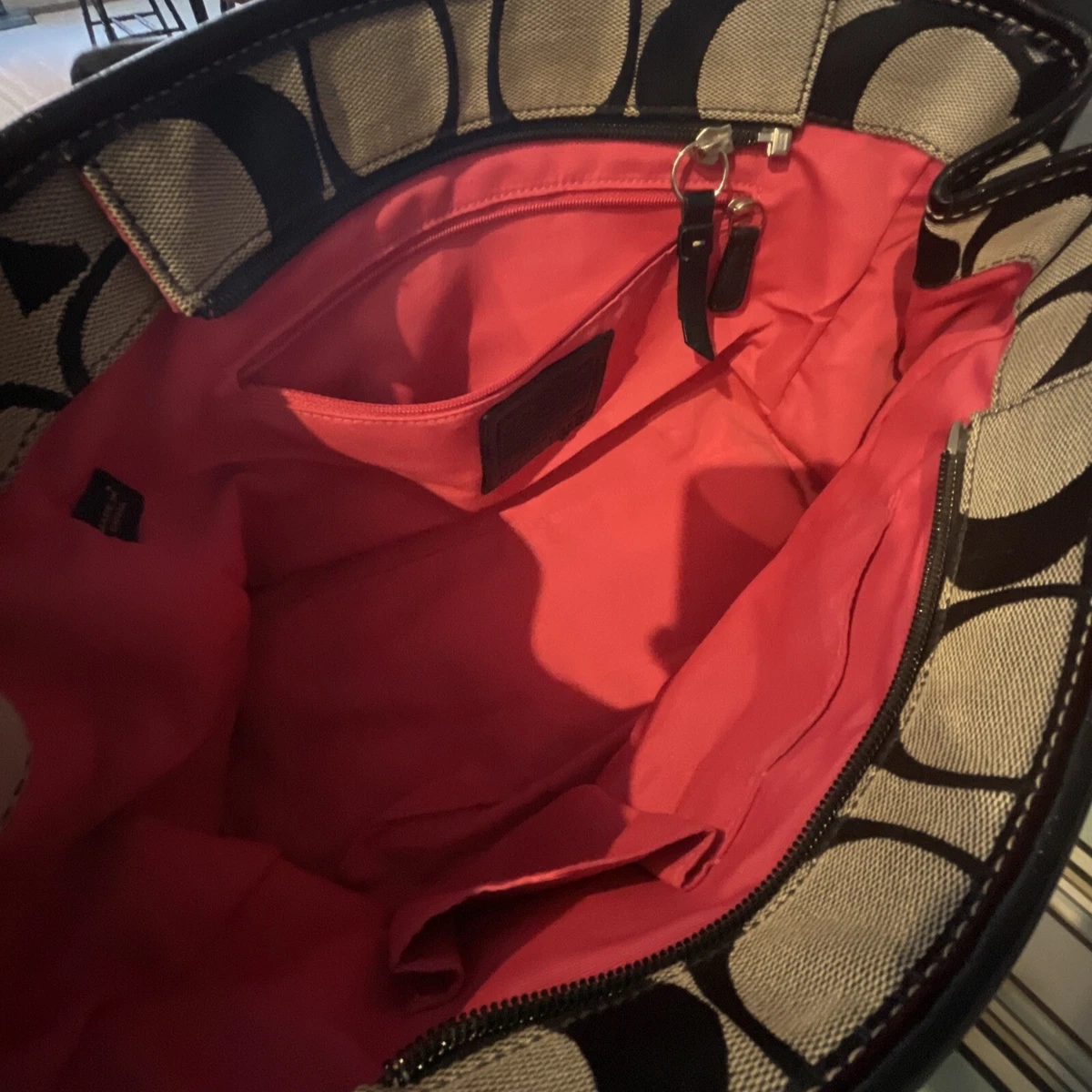 Coach black tote with hotsell red interior