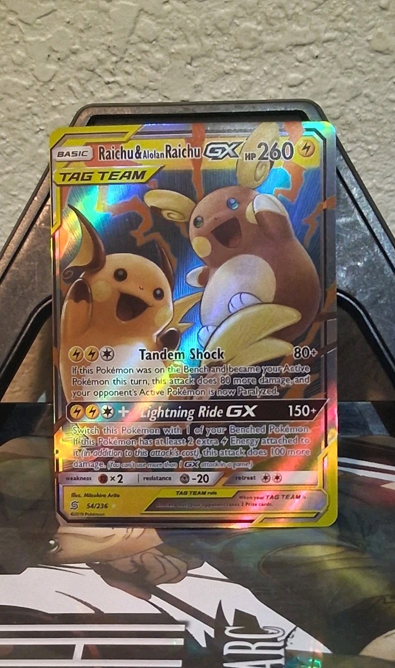 Raichu & Alolan Raichu GX 54/236 – Holo Tag Team Unified Minds Sun & Moon - NM
