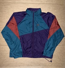 Vintage 90s Nike windbreaker jacket with blue, purple, and red color blocking