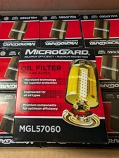 NEW IN MFG BOXES LOT OF 2 MICROGARD MGL57060 OIL FILTERS FITS MOST ENGINES 