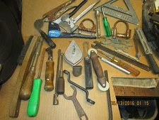 variety of vintage tools pop riveter wrenches pliers screwdrivers files square