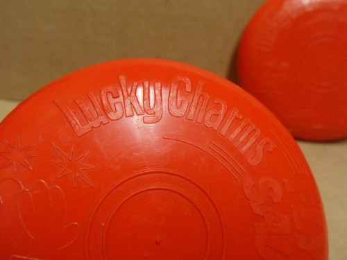 TWO Vintage Cereal Toys Red Lucky Charms Flying Saucer Toy Disc Frisbee - Picture 2 of 8