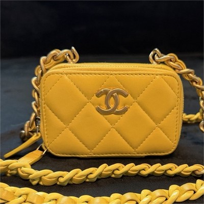 The item in the image is a CHANEL Mini Lacquered Chain Clutch in