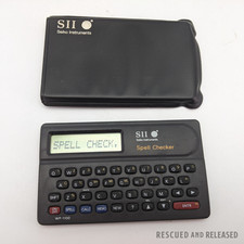  WORKING Seiko Instruments Vintage Spell Checker WP-1100 SII /w Storage Sleeve